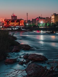 Preview wallpaper city, buildings, architecture, river, stones
