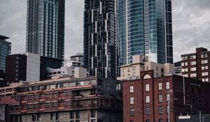 Preview wallpaper city, buildings, architecture, construction, clouds