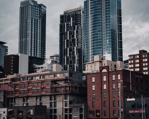 Preview wallpaper city, buildings, architecture, construction, clouds