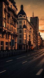 Preview wallpaper city, buildings, architecture, road, cars, sunset