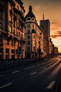 Preview wallpaper city, buildings, architecture, road, cars, sunset