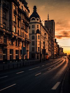 Preview wallpaper city, buildings, architecture, road, cars, sunset
