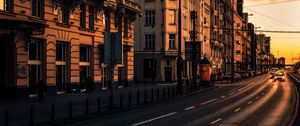 Preview wallpaper city, buildings, architecture, road, cars, sunset
