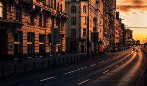 Preview wallpaper city, buildings, architecture, road, cars, sunset