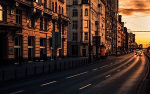 Preview wallpaper city, buildings, architecture, road, cars, sunset