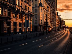 Preview wallpaper city, buildings, architecture, road, cars, sunset