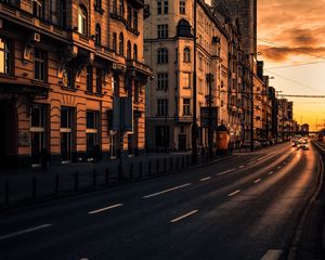 Preview wallpaper city, buildings, architecture, road, cars, sunset
