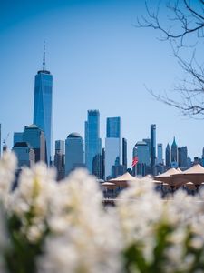 Preview wallpaper city, buildings, architecture, flowers, blur