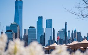Preview wallpaper city, buildings, architecture, flowers, blur