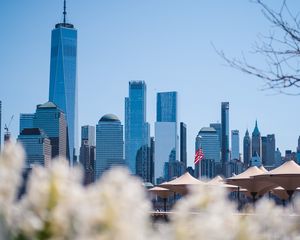 Preview wallpaper city, buildings, architecture, flowers, blur