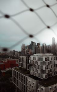Preview wallpaper city, buildings, architecture, mesh, blur