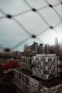 Preview wallpaper city, buildings, architecture, mesh, blur