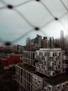 Preview wallpaper city, buildings, architecture, mesh, blur