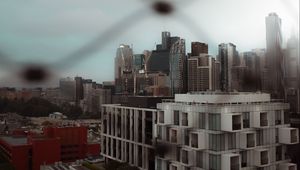 Preview wallpaper city, buildings, architecture, mesh, blur