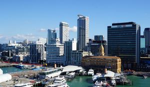 Preview wallpaper city, buildings, architecture, pier, boats, aerial view