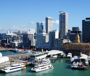 Preview wallpaper city, buildings, architecture, pier, boats, aerial view