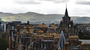 Preview wallpaper city, buildings, architecture, mountains, aerial view
