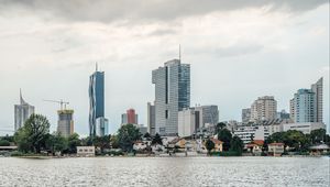 Preview wallpaper city, buildings, architecture, clouds, water