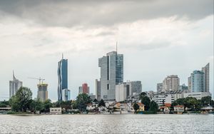 Preview wallpaper city, buildings, architecture, clouds, water