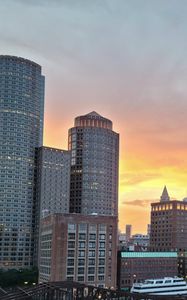 Preview wallpaper city, buildings, architecture, aerial view, sunset