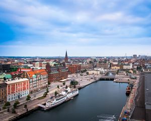 Preview wallpaper city, buildings, architecture, river, boat, aerial view