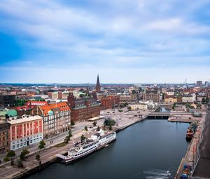 Preview wallpaper city, buildings, architecture, river, boat, aerial view