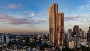 Preview wallpaper city, buildings, architecture, trees, twilight, aerial view