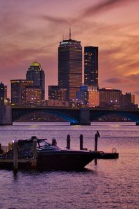 Preview wallpaper city, buildings, architecture, water, pier, sunset