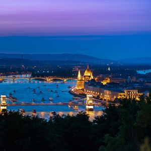 Preview wallpaper city, buildings, backlight, water, twilight, aerial view