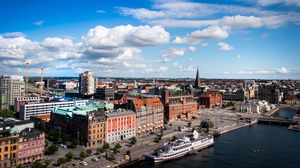 Preview wallpaper city, buildings, boat, river, architecture