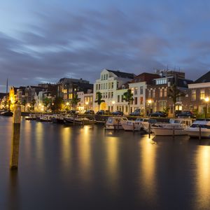 Preview wallpaper city, buildings, boats, water, lights, twilight