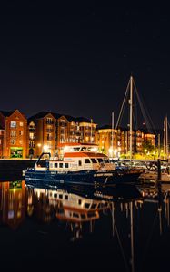 Preview wallpaper city, buildings, boats, pier, night, dark