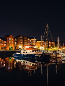 Preview wallpaper city, buildings, boats, pier, night, dark