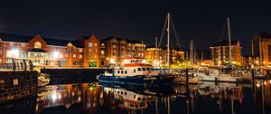 Preview wallpaper city, buildings, boats, pier, night, dark