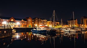 Preview wallpaper city, buildings, boats, pier, night, dark