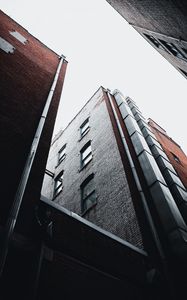 Preview wallpaper city, buildings, bottom view, facade, brick