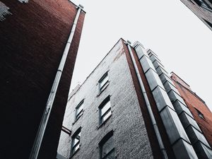 Preview wallpaper city, buildings, bottom view, facade, brick