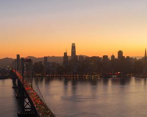 Preview wallpaper city, buildings, bridge, evening, water