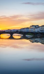 Preview wallpaper city, buildings, bridge, lake, reflection, sunset