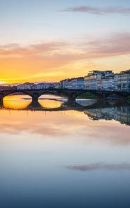 Preview wallpaper city, buildings, bridge, lake, reflection, sunset