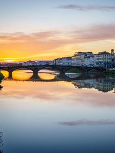 Preview wallpaper city, buildings, bridge, lake, reflection, sunset