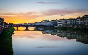 Preview wallpaper city, buildings, bridge, lake, reflection, sunset