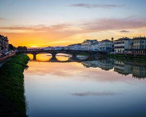 Preview wallpaper city, buildings, bridge, lake, reflection, sunset