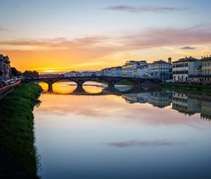 Preview wallpaper city, buildings, bridge, lake, reflection, sunset