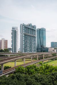 Preview wallpaper city, buildings, bridge, road, junction, trees