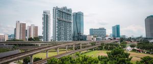 Preview wallpaper city, buildings, bridge, road, junction, trees