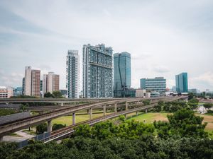 Preview wallpaper city, buildings, bridge, road, junction, trees