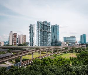 Preview wallpaper city, buildings, bridge, road, junction, trees