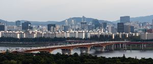 Preview wallpaper city, buildings, bridge, trees, river, aerial view