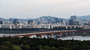 Preview wallpaper city, buildings, bridge, trees, river, aerial view